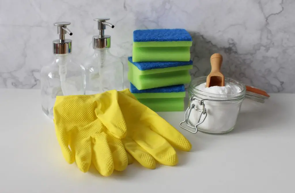 An image showing baking soda and kitchen gloves